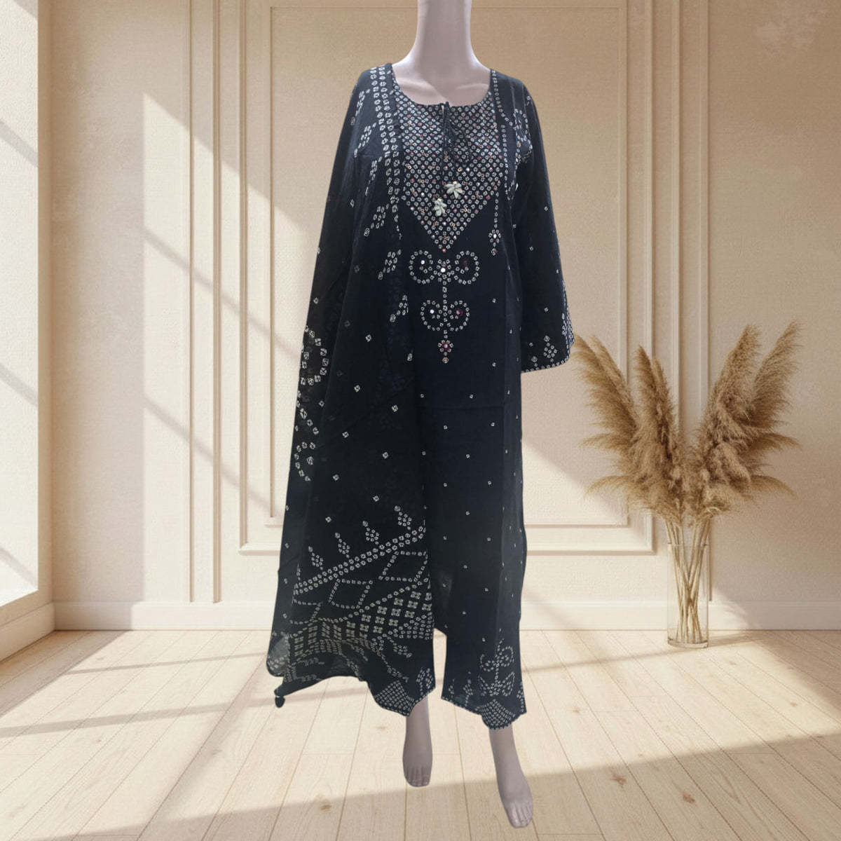 Black mul cotton A-line kurti with Bandhani print, side pockets and tassel tie-up neckline