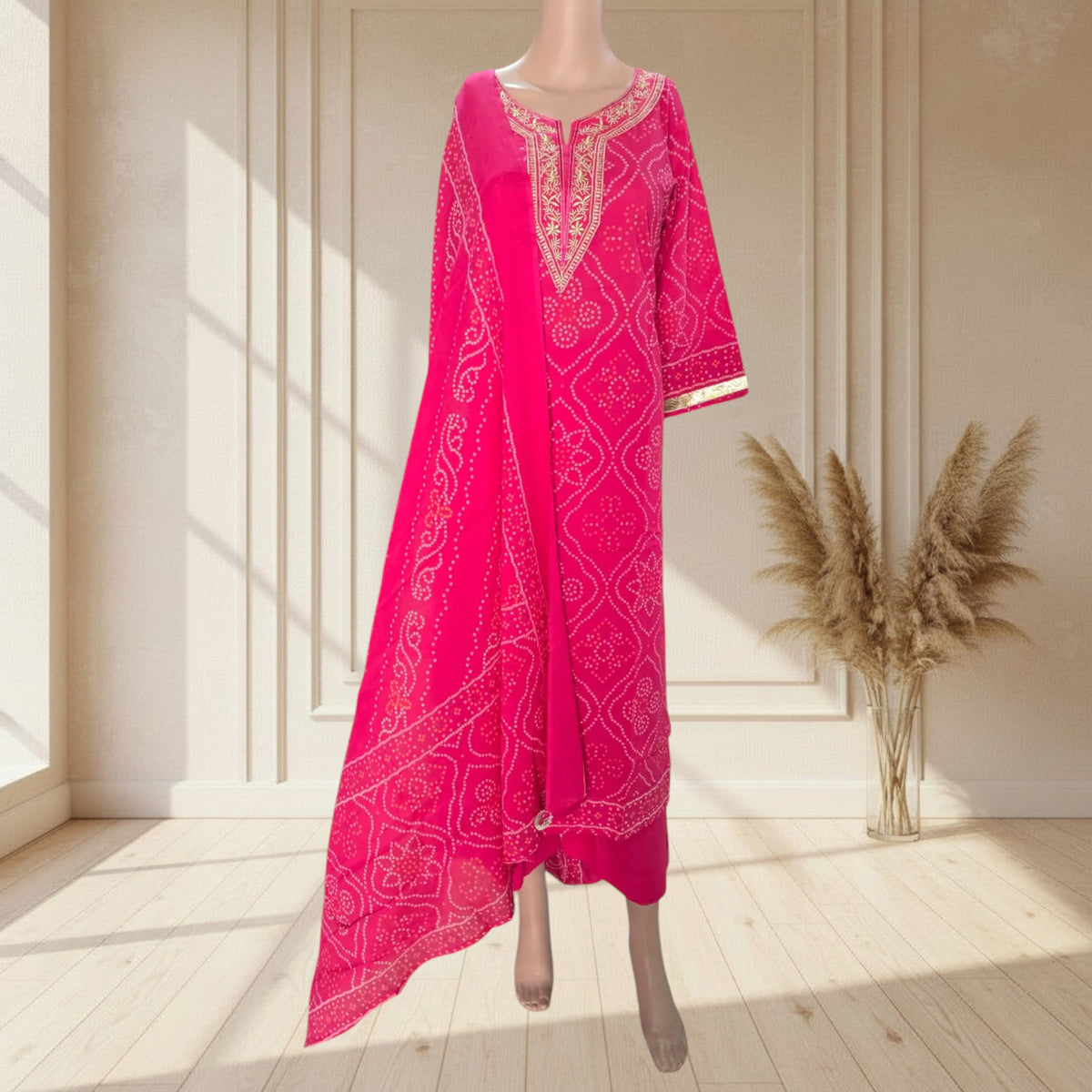 Rani pink cotton kurti with Bandhani-style print and gold sleeve trims
