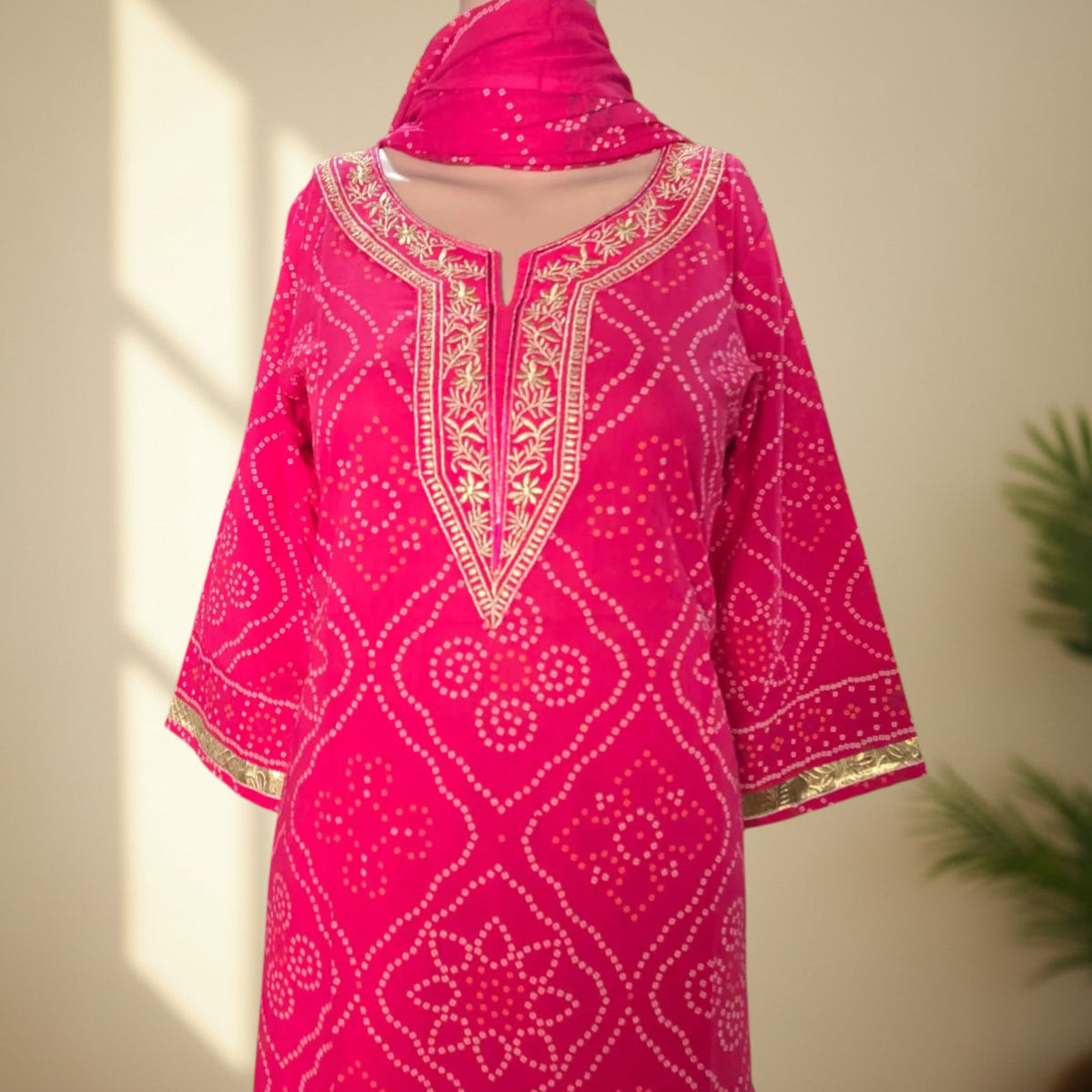 Rani pink cotton suit set with solid palazzo and Bandhani print dupatta